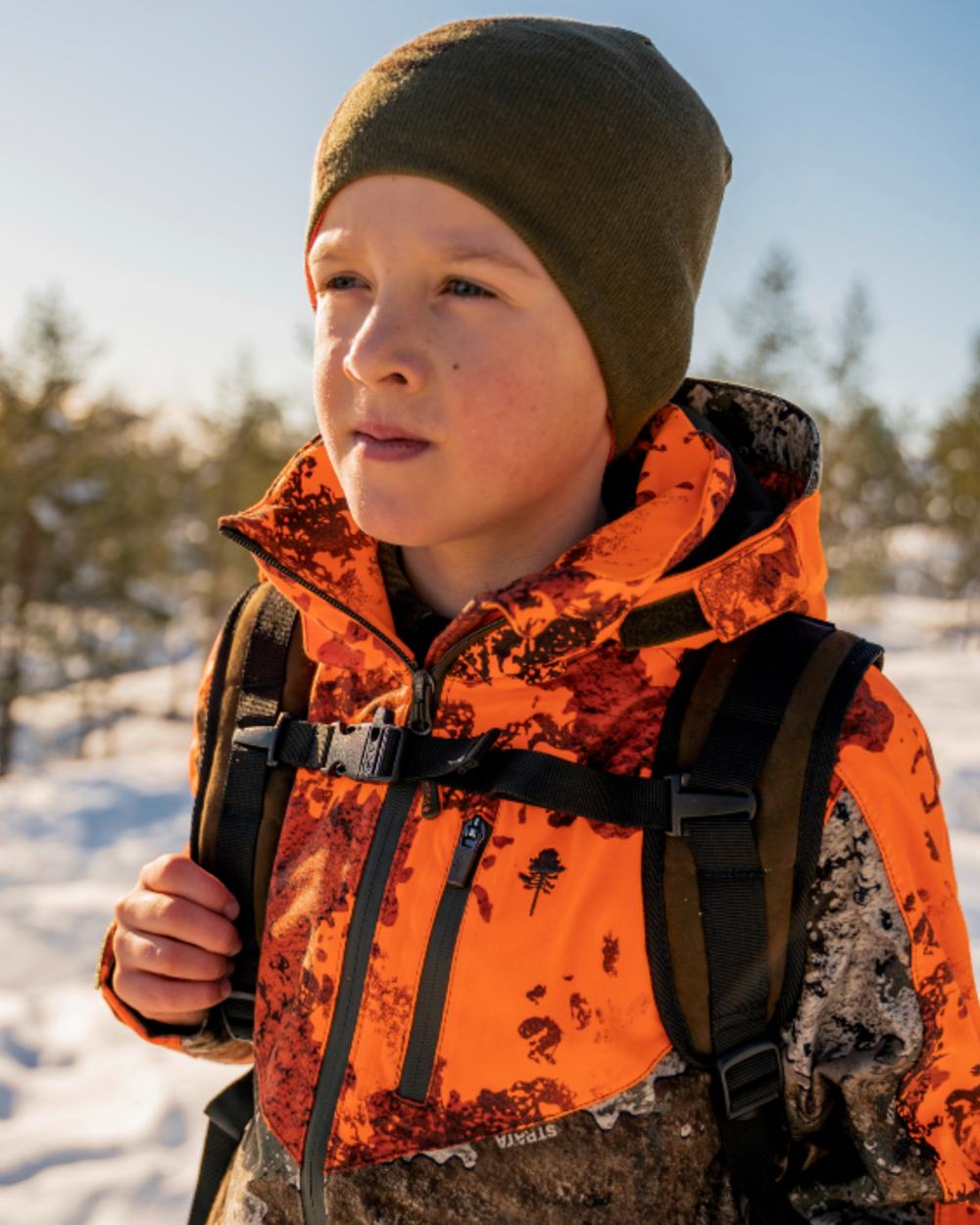 Orange Green coloured Pinewood Childrens Tree Hat on snow background