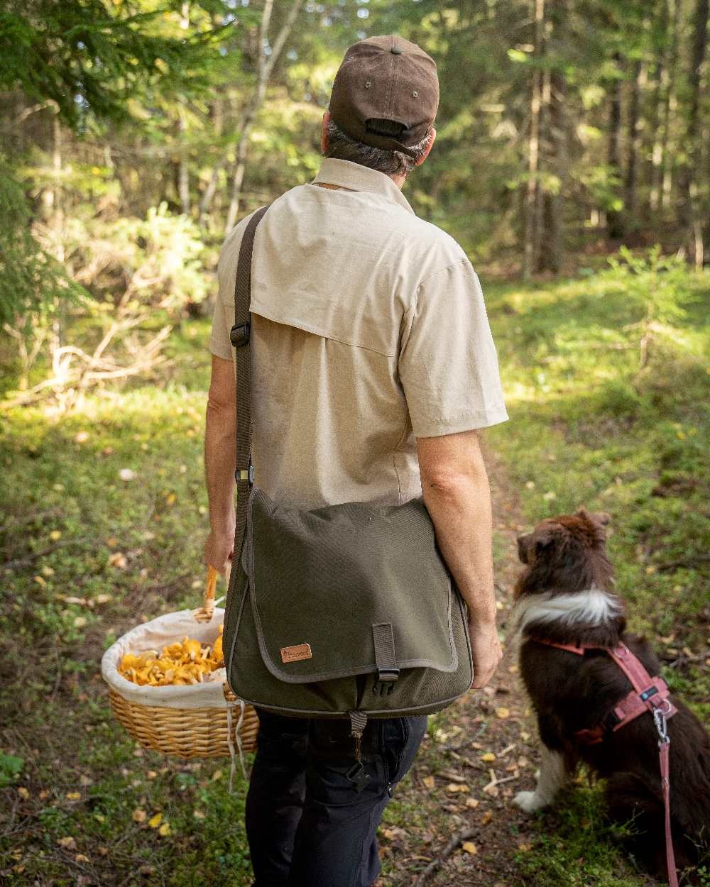 Moss Green Coloured Pinewood Dog Sports Shoulder Bag on outdoor background