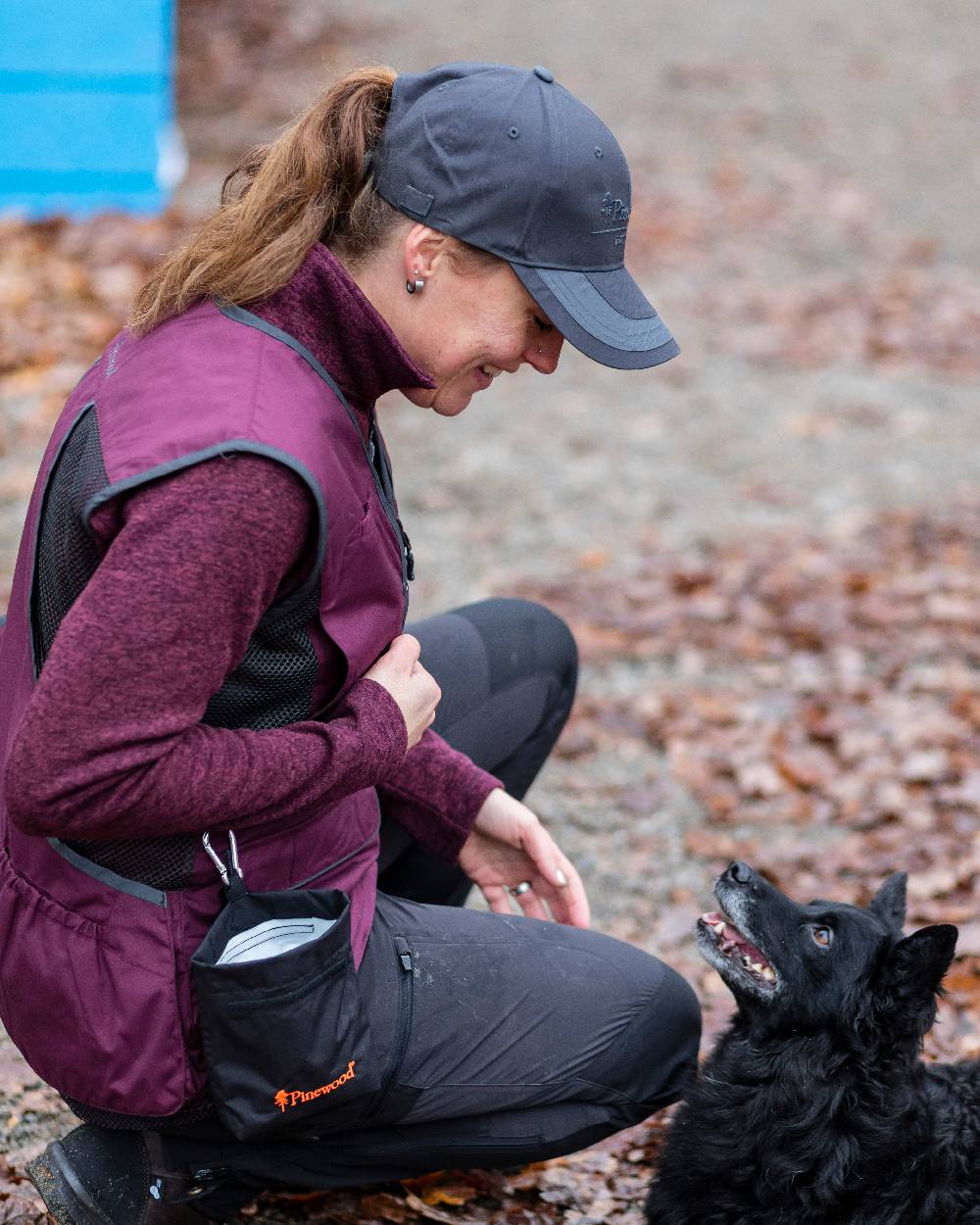Black Coloured Pinewood Dog Sports Treat Bag on outdoor background