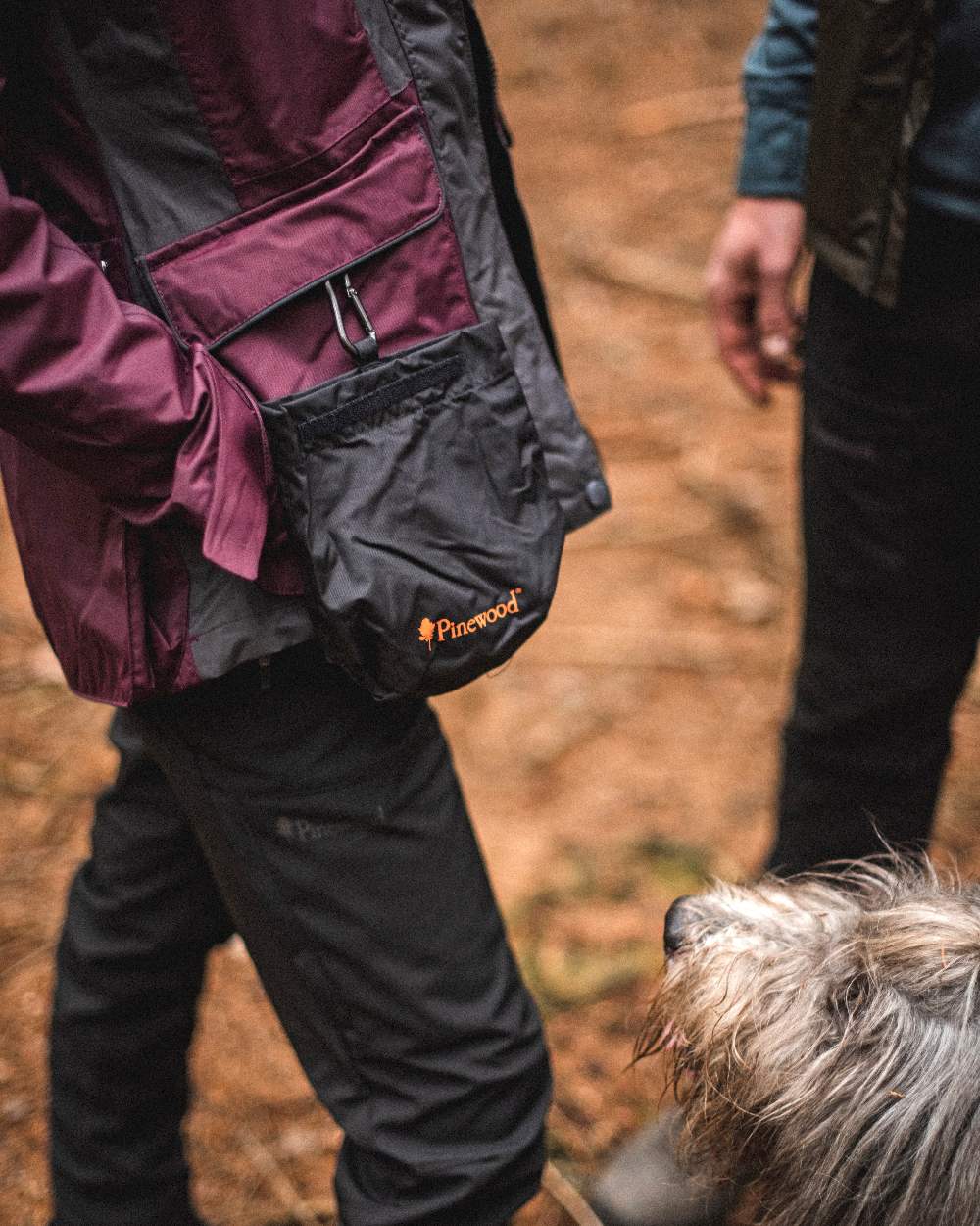Black Coloured Pinewood Dog Sports Treat Bag on outdoor background