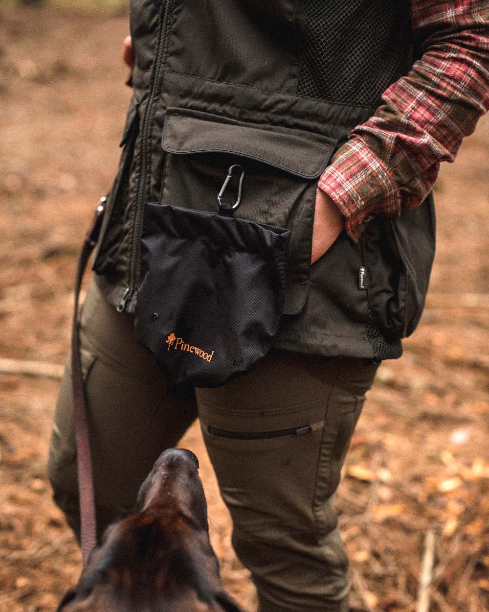 Black Coloured Pinewood Dog Sports Treat Bag on outdoor background