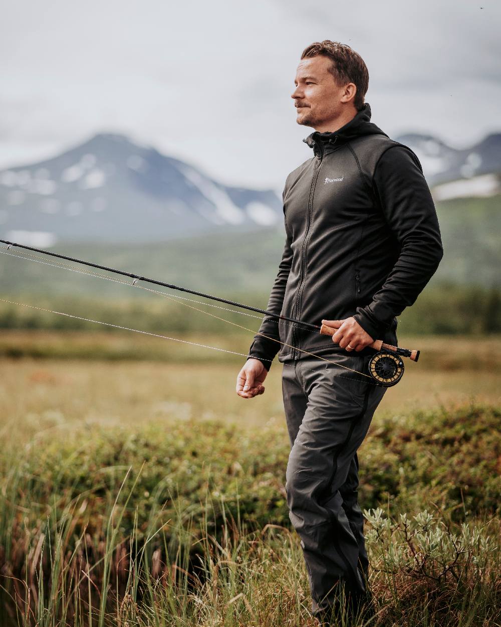 Black Coloured Pinewood Finnveden Hoodie on outdoor background