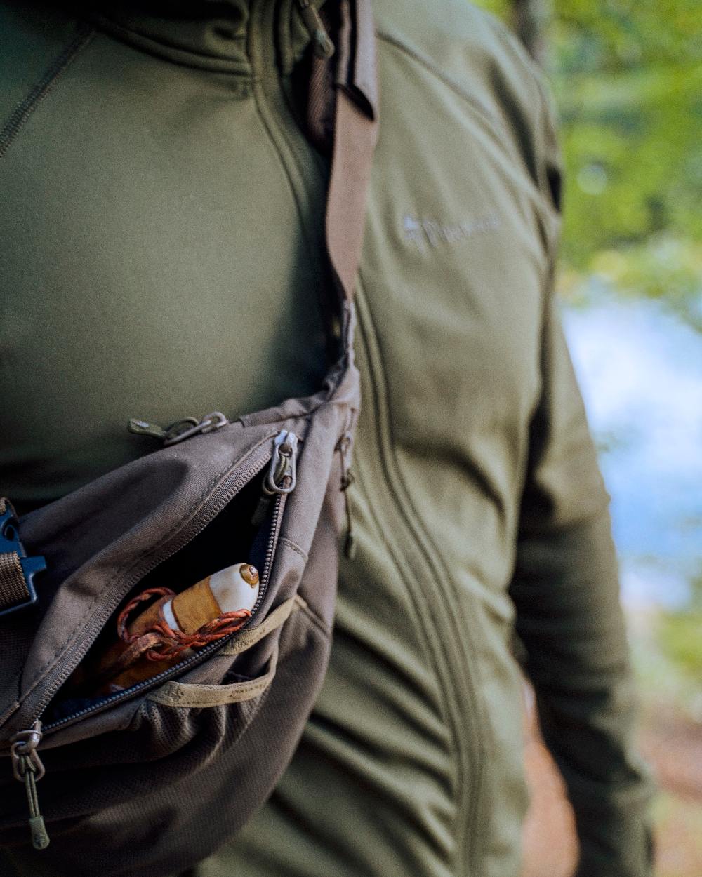 Moss Green Coloured Pinewood Finnveden Hoodie on outdoor background