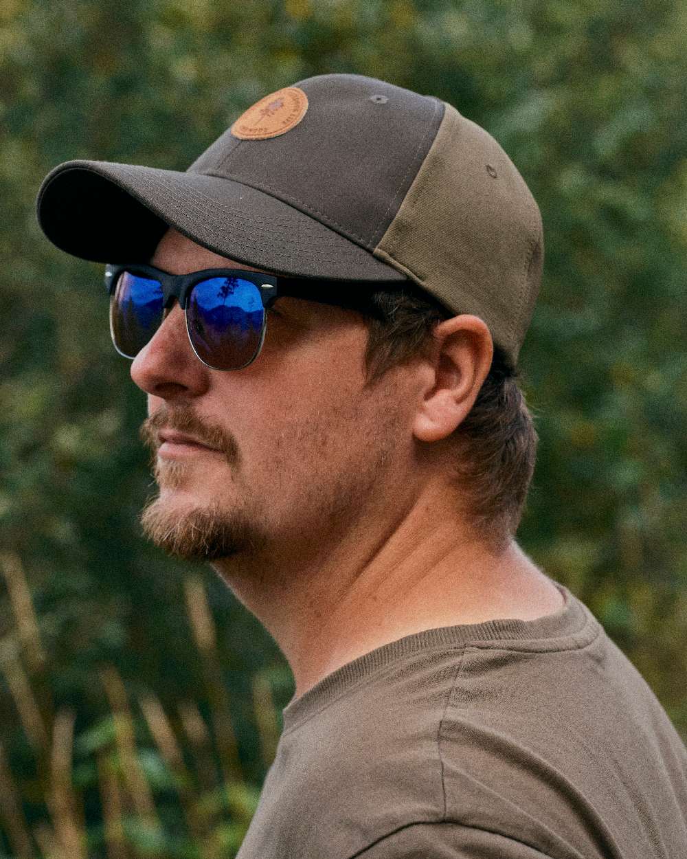 Dark Olive Hunting Olive Coloured Pinewood Finnveden Hybrid Cap on outdoor background