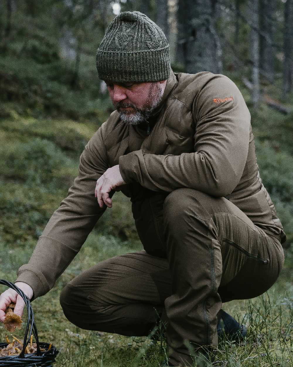 Green Mel Coloured Pinewood Knitted Melange Hat on outdoor background