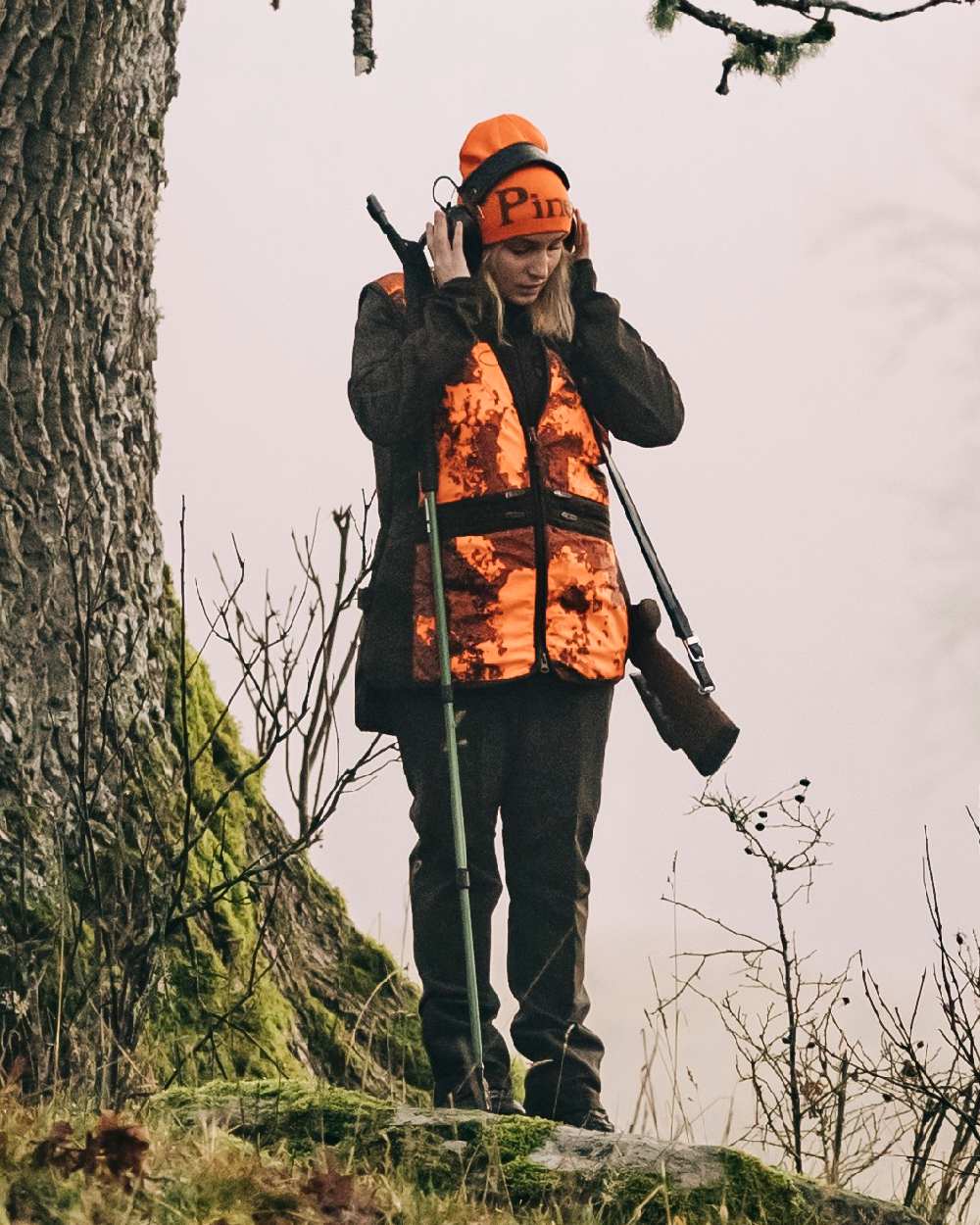 Orange Green Coloured Pinewood Melange Hat on outdoor background