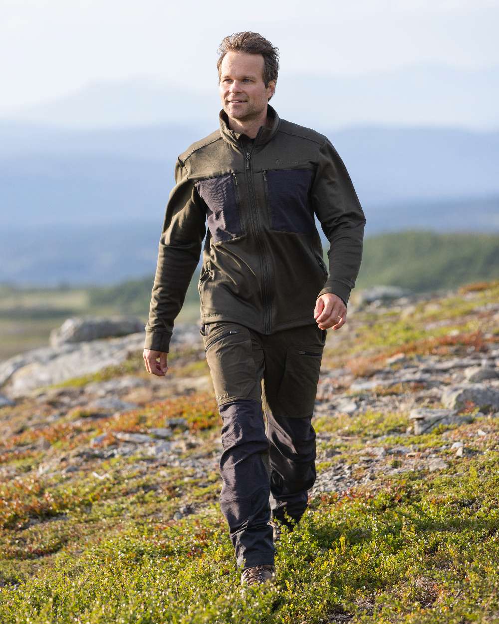 Moss Green Coloured Pinewood Mens Abisko Adventure Trousers on outdoor background