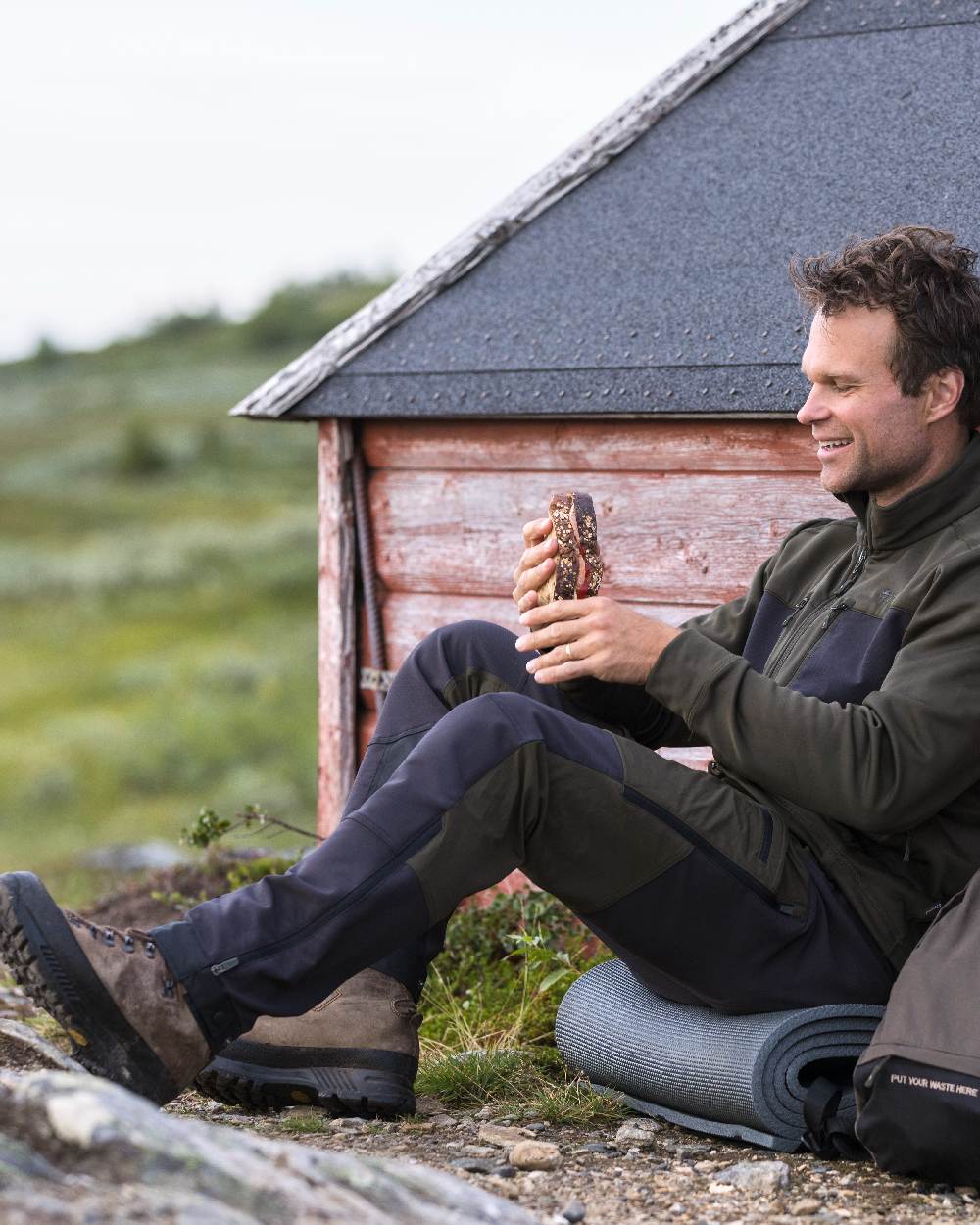 Moss Green Coloured Pinewood Mens Abisko Adventure Trousers on outdoor background