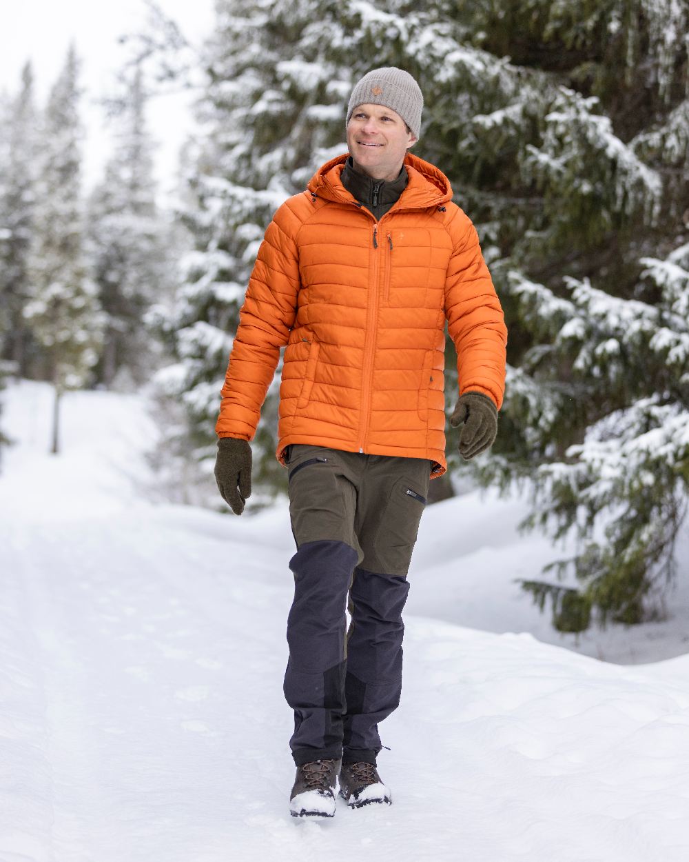 Moss Green Coloured Pinewood Mens Abisko Adventure Trousers on snow background