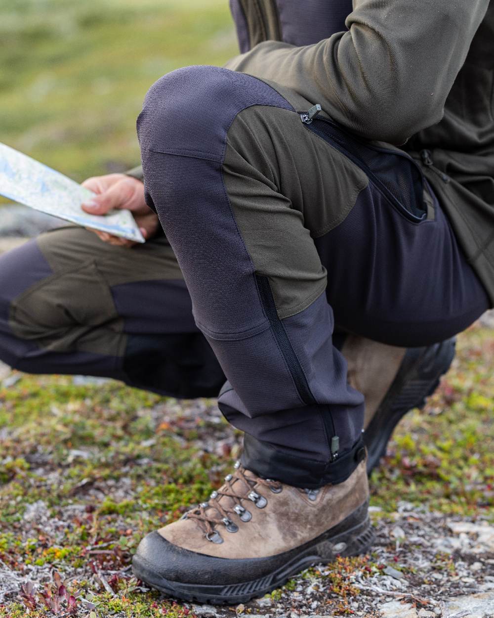 Moss Green Coloured Pinewood Mens Abisko Adventure Trousers on outdoor background