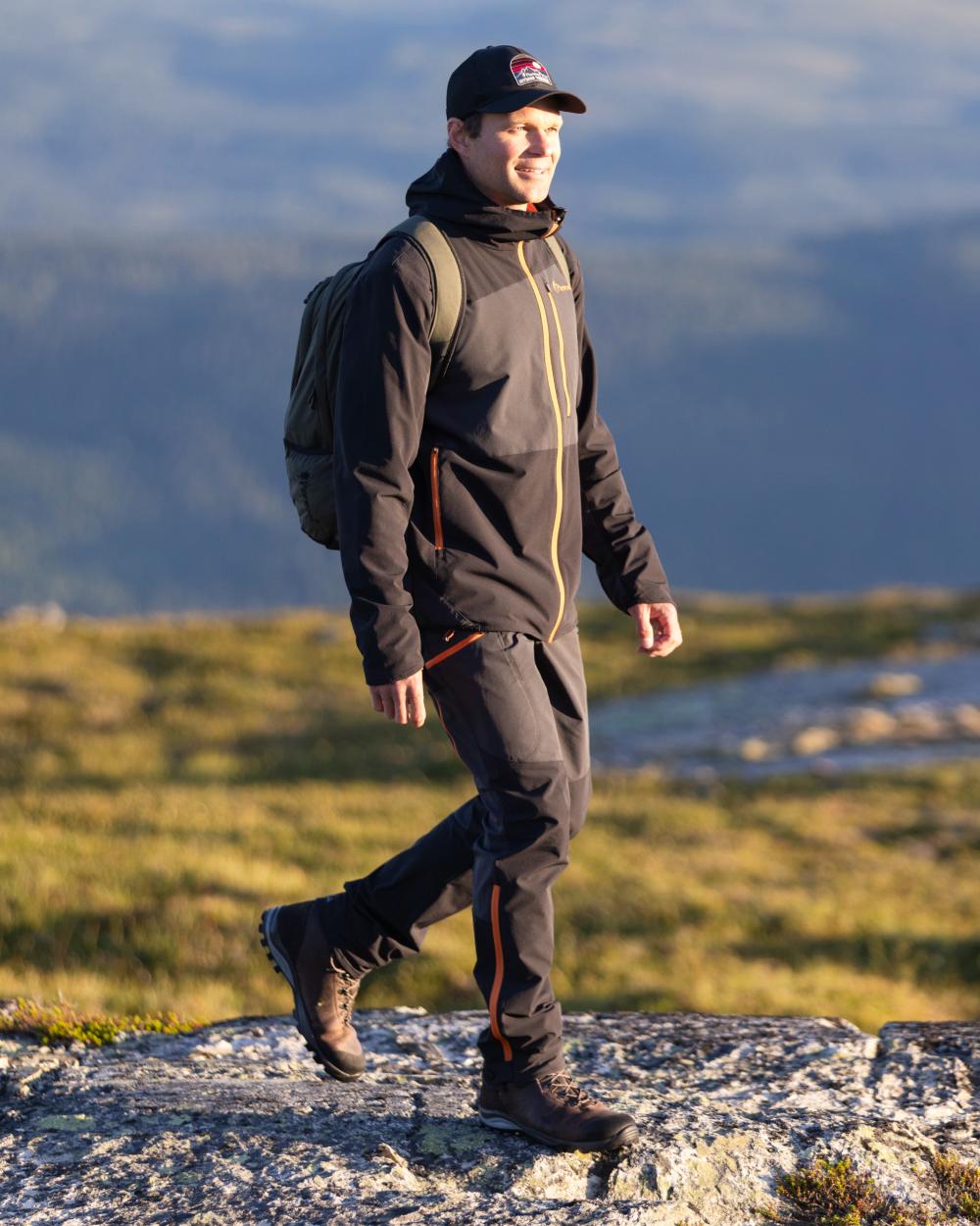 Dark Anthracite Black Coloured Pinewood Mens Abisko Light Stretch Jacket on mountain background