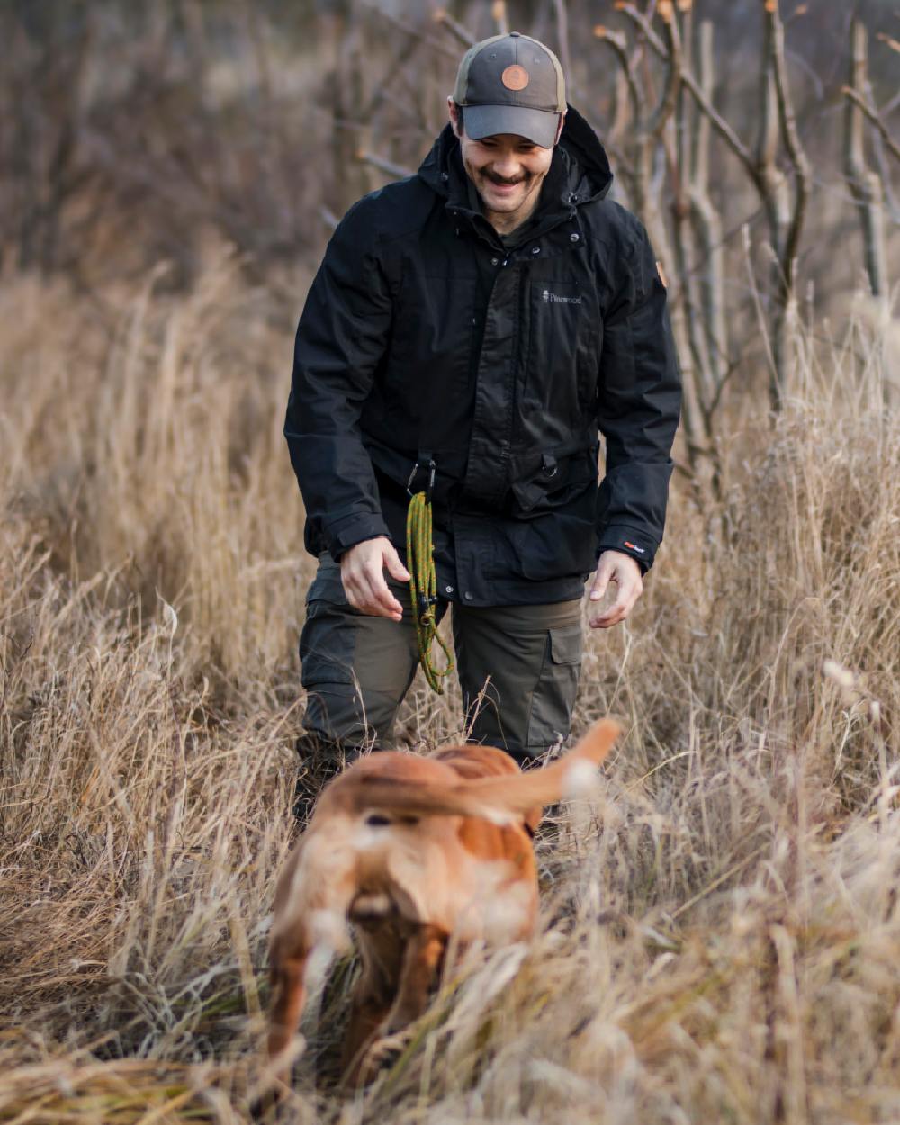 Moss Green Coloured Pinewood Mens Dog Sports Trainer Extreme Trousers on outdoor background