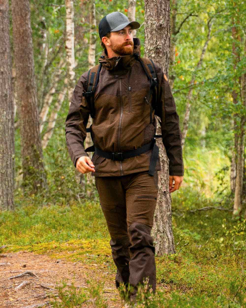 Dark Brown Coloured Pinewood Mens Finnveden Hybrid Jacket on outdoor background