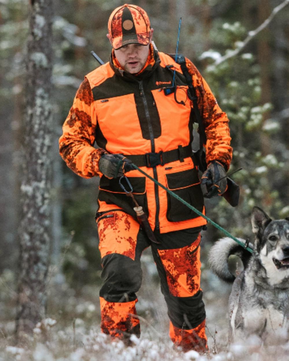 Orange Moss Green coloured Pinewood Mens Furudal Dog Handler Vest on forest background