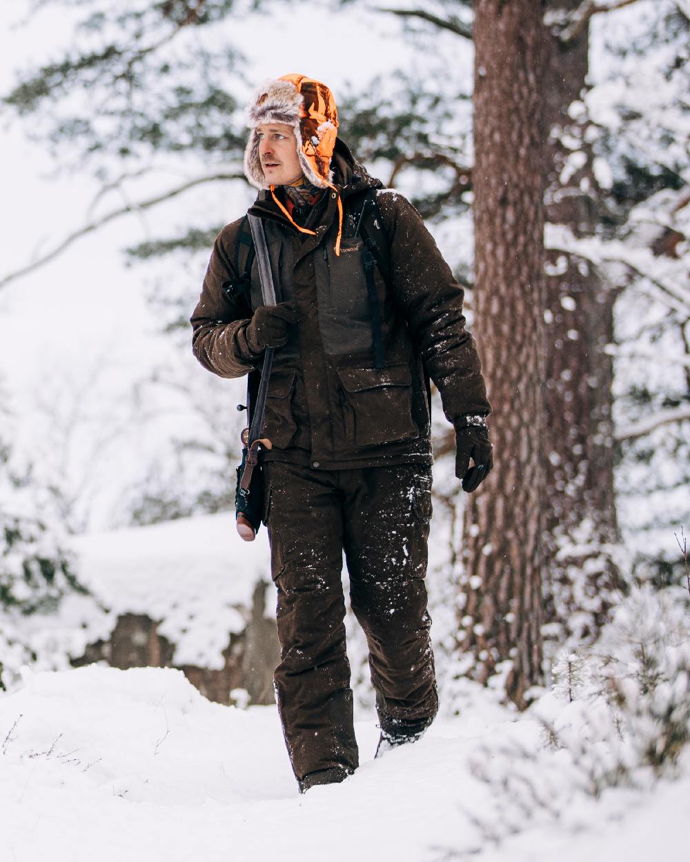 Suede Brown Coloured Pinewood Mens Smaland Abisko 2.0 Hunting Jacket on snow background