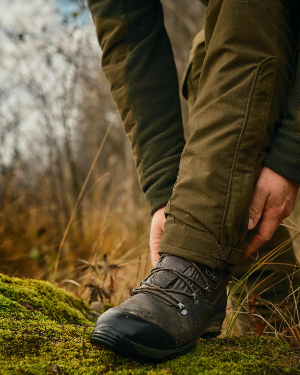 Hunting Green coloured Pinewood Mens Smaland Forest Trousers on forest background