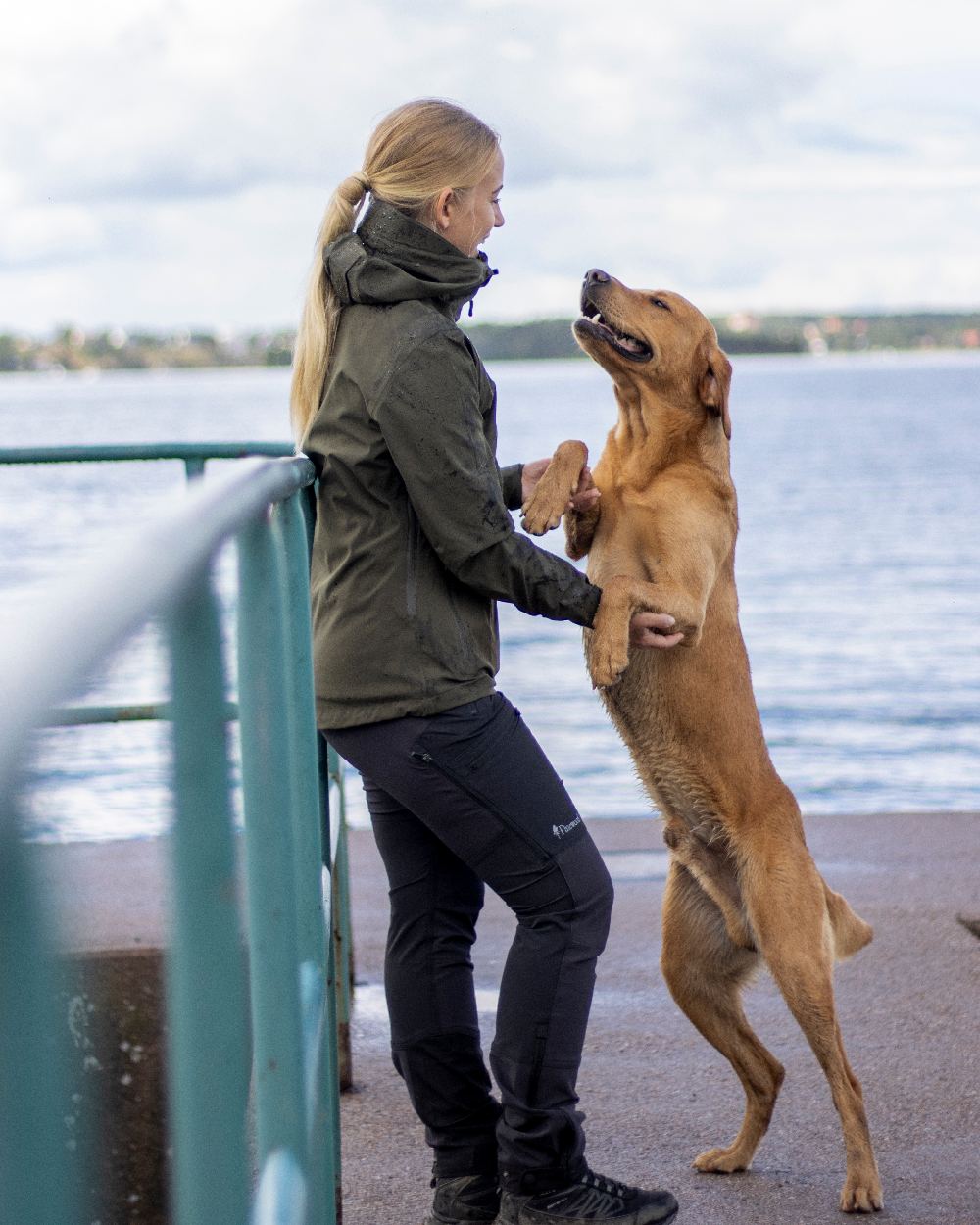 Black Coloured Pinewood Womens Abisko Adventure Trousers on river background