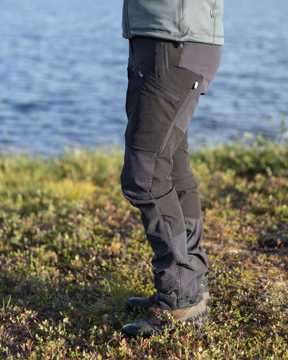 Black Coloured Pinewood Womens Abisko Adventure Trousers on coastal background