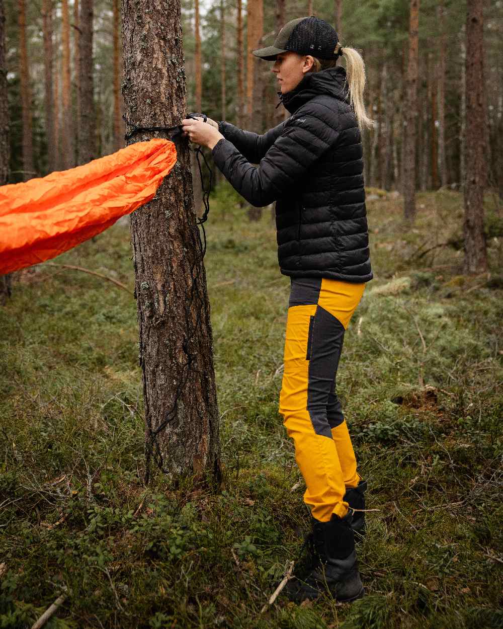 Black Coloured Pinewood Womens Abisko Insulation Jacket on forest background