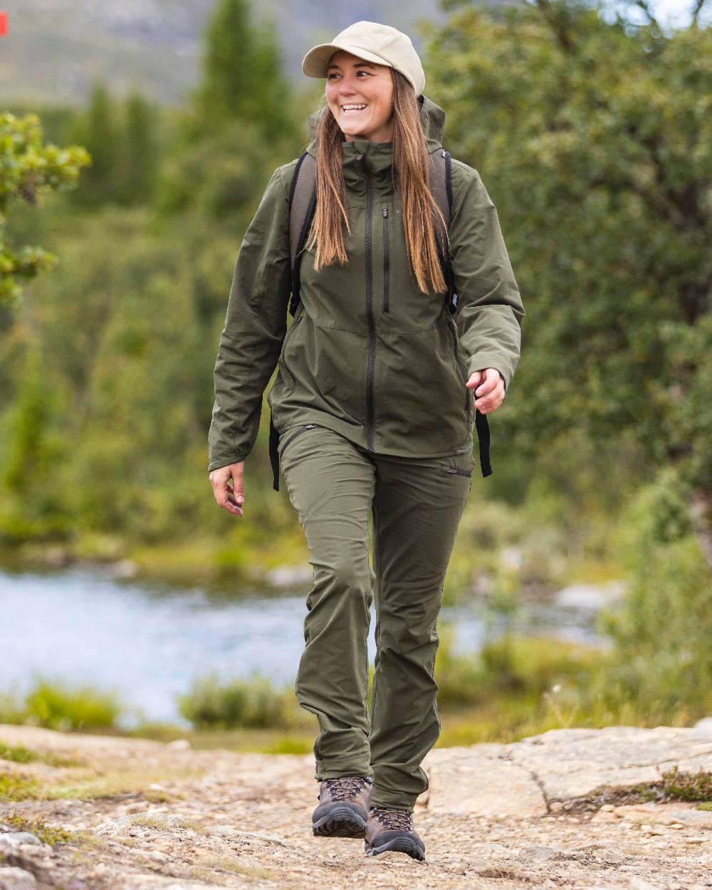 Mossgreen Coloured Pinewood Womens Abisko Light Stretch Jacket on outdoor background