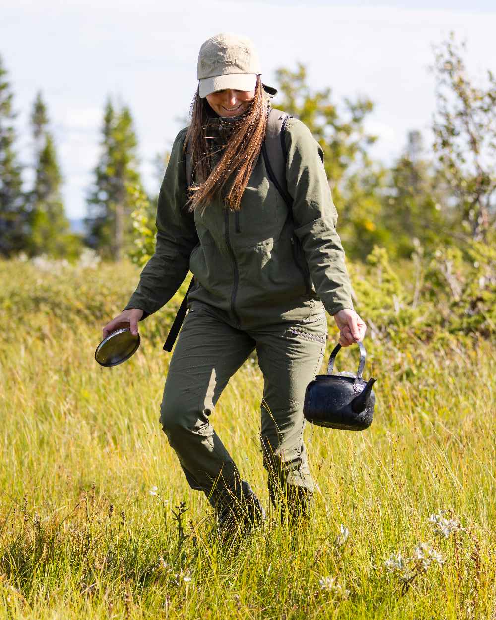 Mossgreen Coloured Pinewood Womens Abisko Light Stretch Trousers on outdoor background