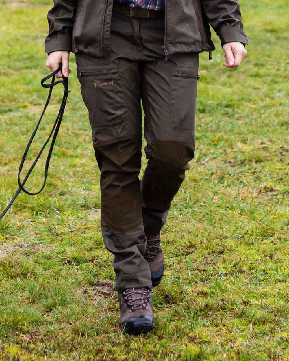 Dark Olive coloured Pinewood Womens Caribou TC Trousers on grass background