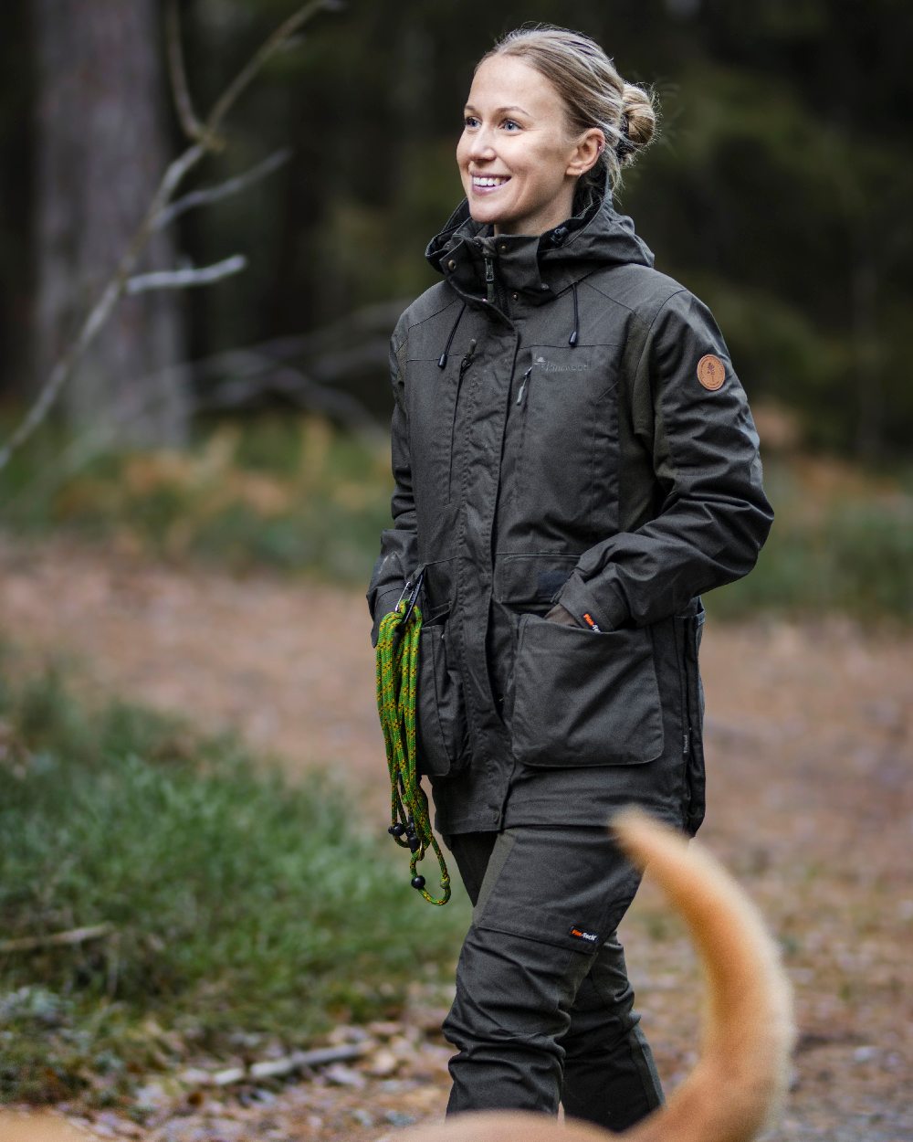 Moss Green Coloured Pinewood Womens Dog Sports Trainer Extreme Jacket on outdoor background