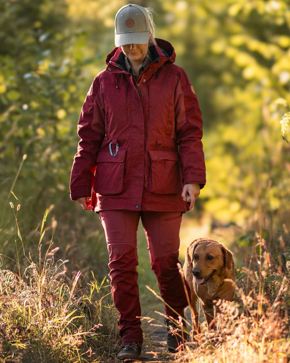 Dark Tomato Dark Red Coloured Pinewood Womens Dog Sports Trainer Jacket on outdoor background