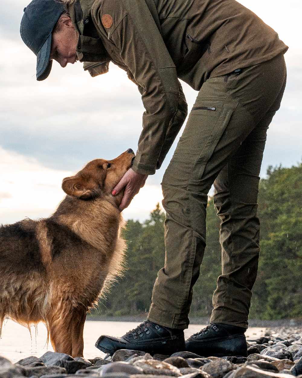 Hunting Olive Coloured Pinewood Womens Finnveden Hybrid Trousers on outdoor background