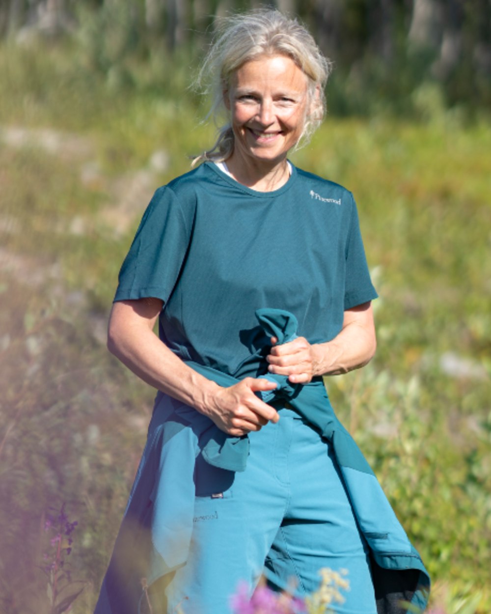 Dark Teal Blue coloured Pinewood Womens Function T-Shirt on outdoor background