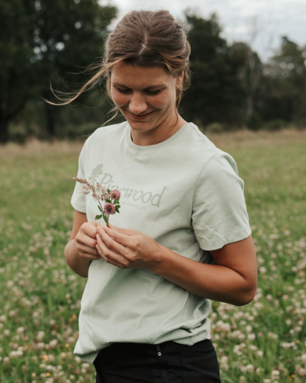 Frosty Green coloured Pinewood Womens Outdoor Life T-Shirt on forest background