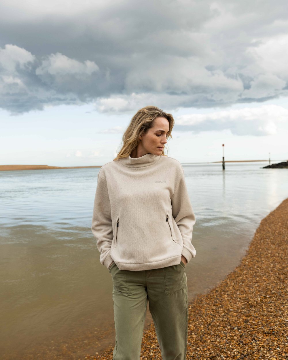 Pumice Coloured Musto Womens Classic Fleece Pullover On A Beach Background