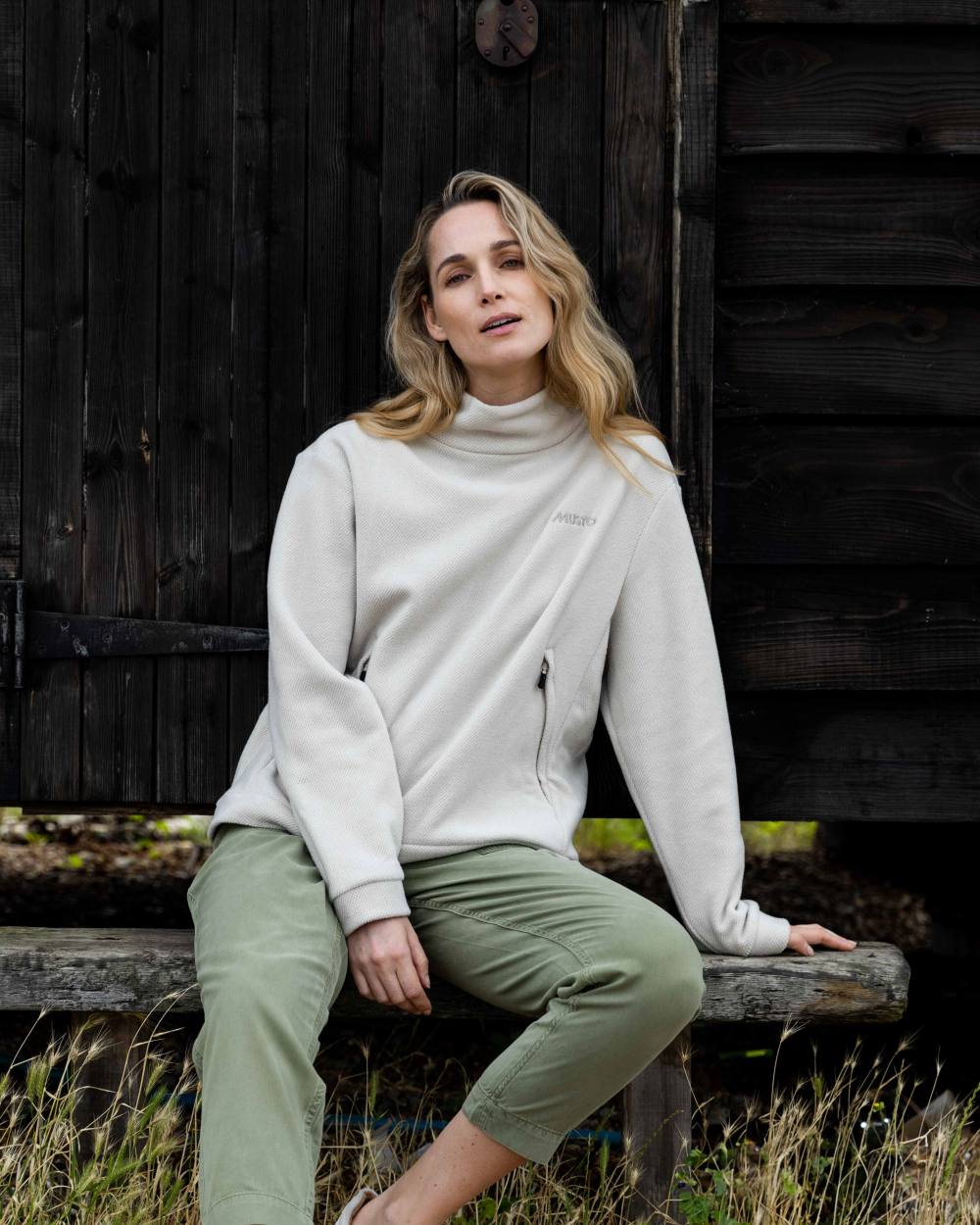 Pumice Coloured Musto Womens Classic Fleece Pullover On A Coastal Background