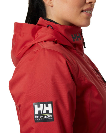 Red Coloured Helly Hansen Womens Crew Hooded Midlayer Sailing Jacket 2.0 On A White Background 