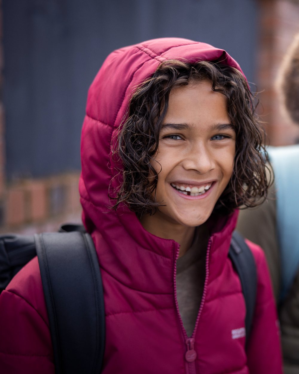 Dark Pimento Coloured Regatta Childrens Halkner Quilted Jacket on outdoor background