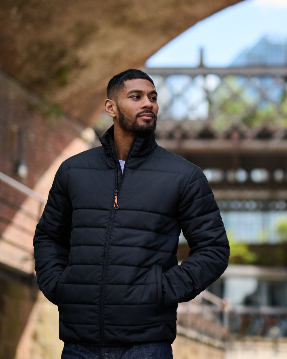 Black coloured Regatta Mens Essential Thermal Jacket on blurry background