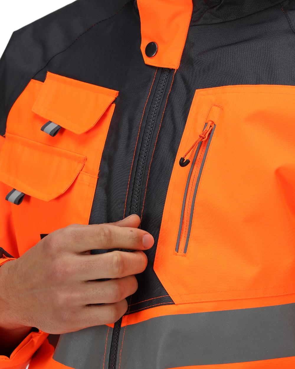 Orange Grey coloured Regatta Mens Hi-Vis Waterproof Reflective Parka Jacket on white background