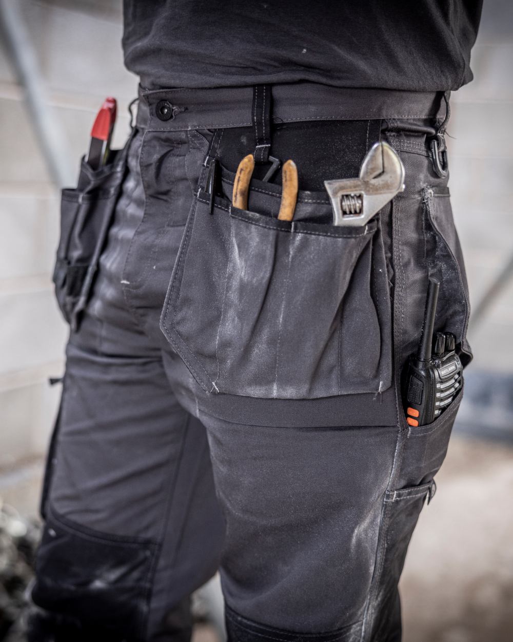 Iron coloured Regatta Mens Incursion Work Trousers on blurry background