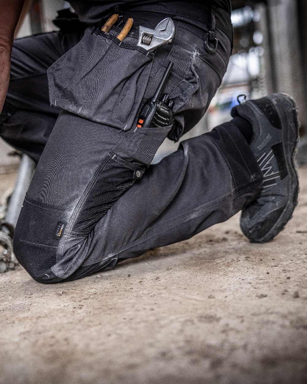 Iron coloured Regatta Mens Incursion Work Trousers on blurry background