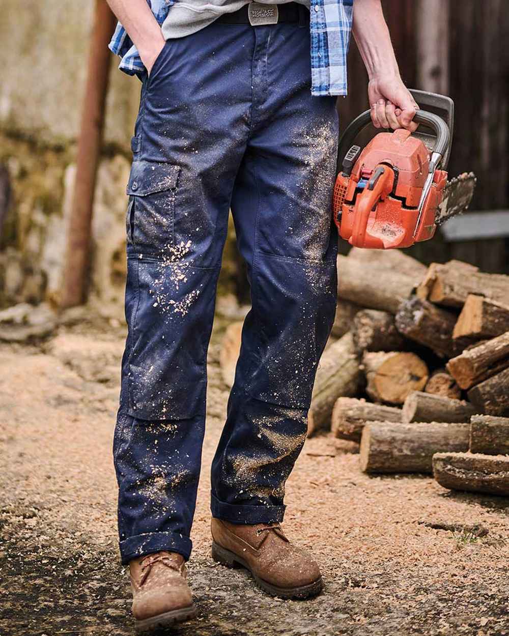 Navy coloured Regatta Pro Cargo Trousers on blurry background