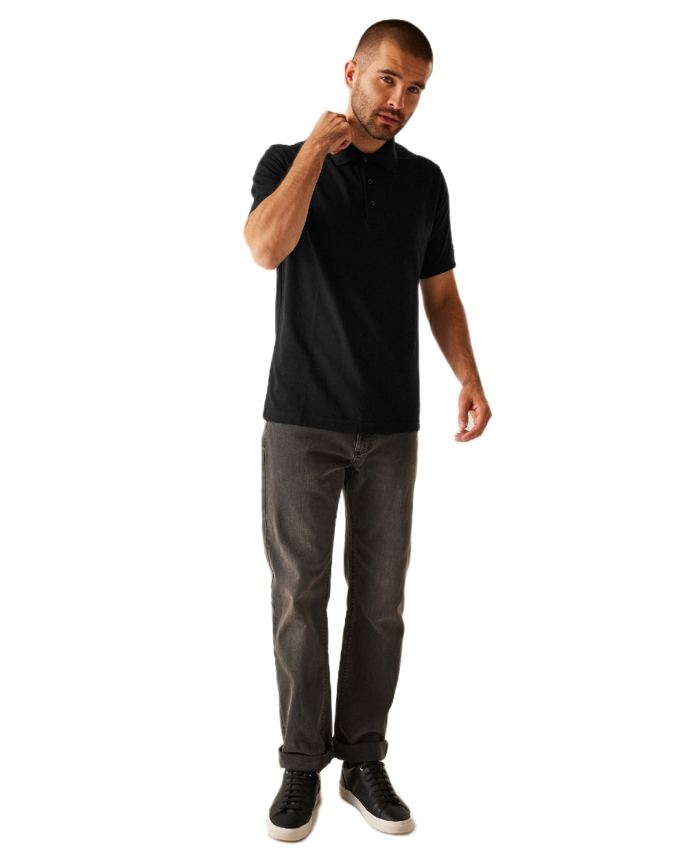 Black coloured Regatta Professional Mens 65/35 Short Sleeves Polo Top on white background