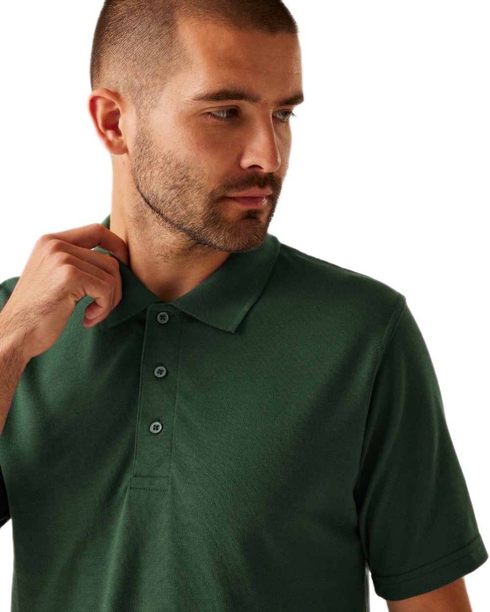 Dark Green coloured Regatta Professional Mens 65/35 Short Sleeves Polo Top on white background