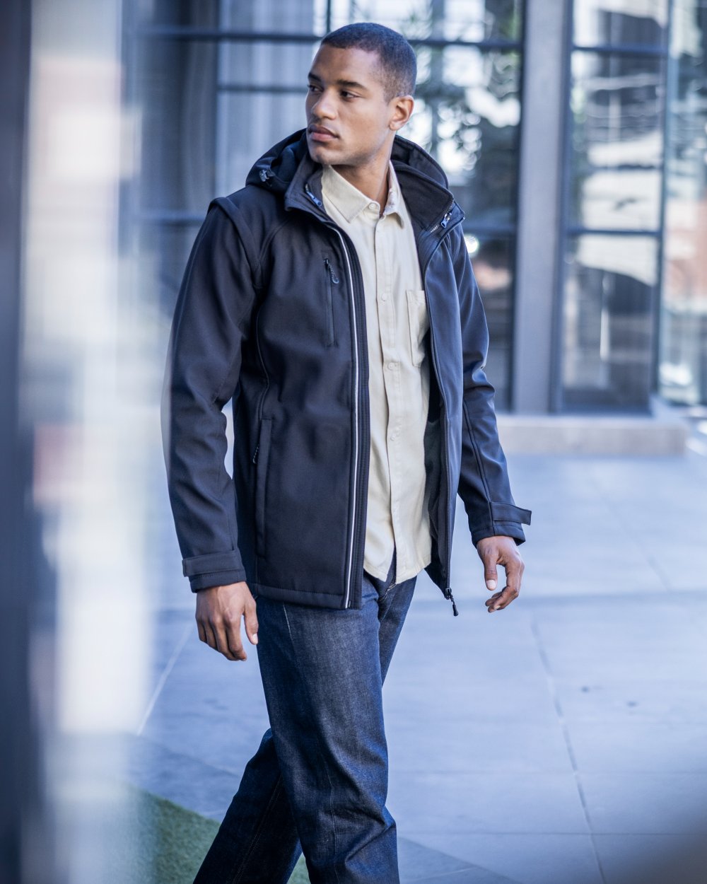 Black coloured Regatta Professional Mens Erasmus 4 In 1 Softshell Jacket on outdoor background