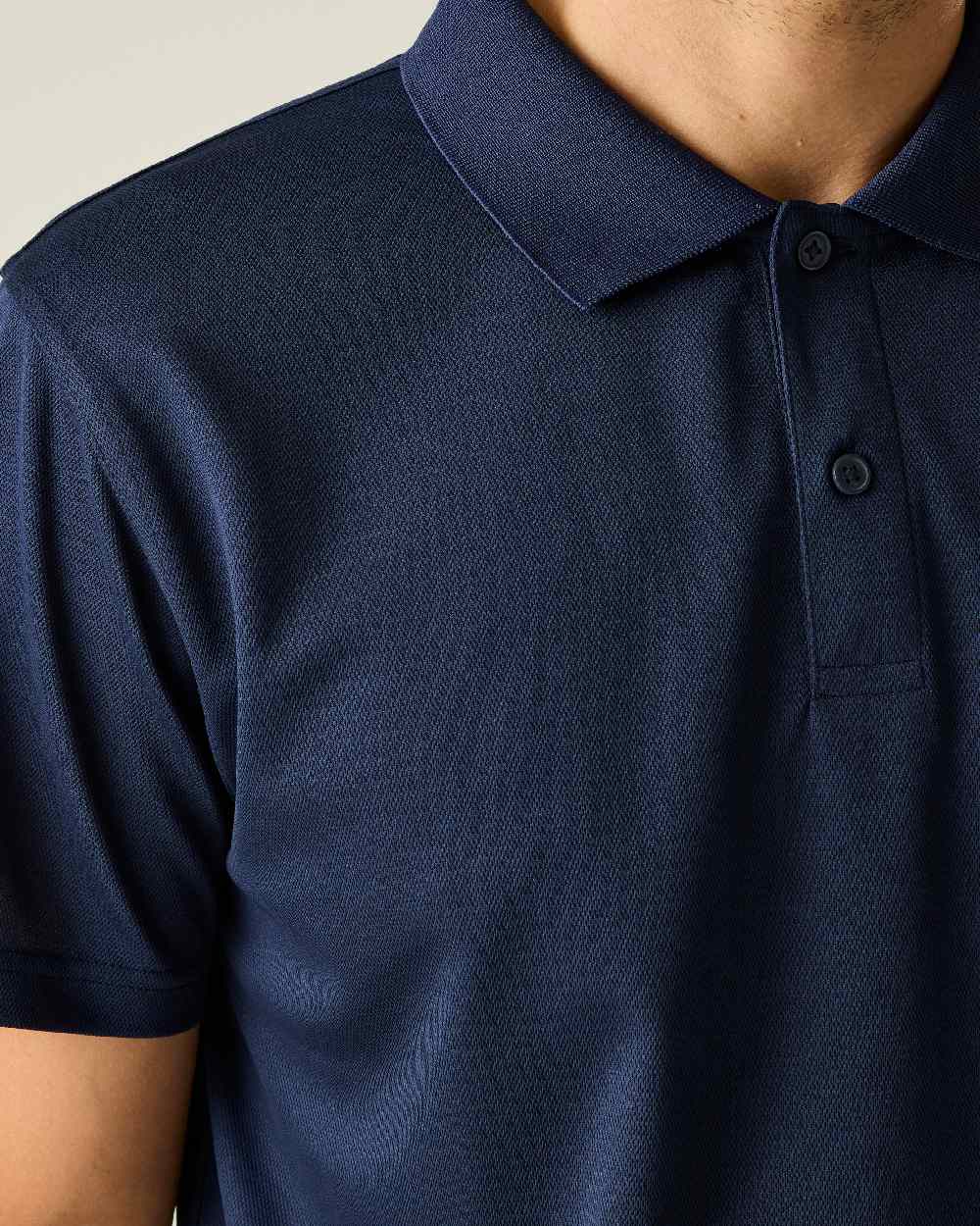 Navy colour Regatta Professional Mens Pro Wicking Pique Polo Shirt on beige background