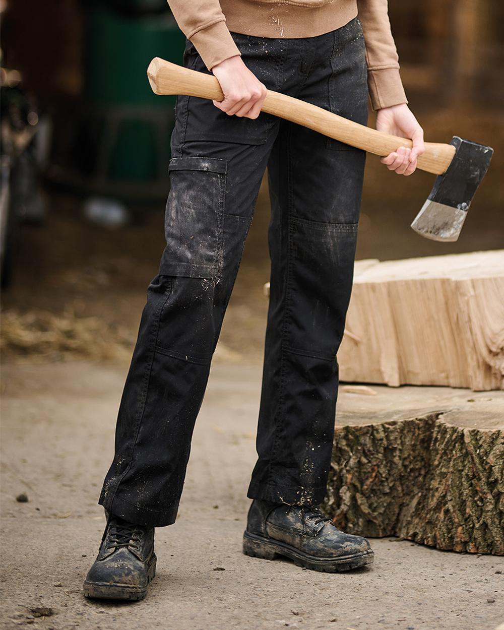 Black coloured Regatta Womens New Action II Trousers on blurry background