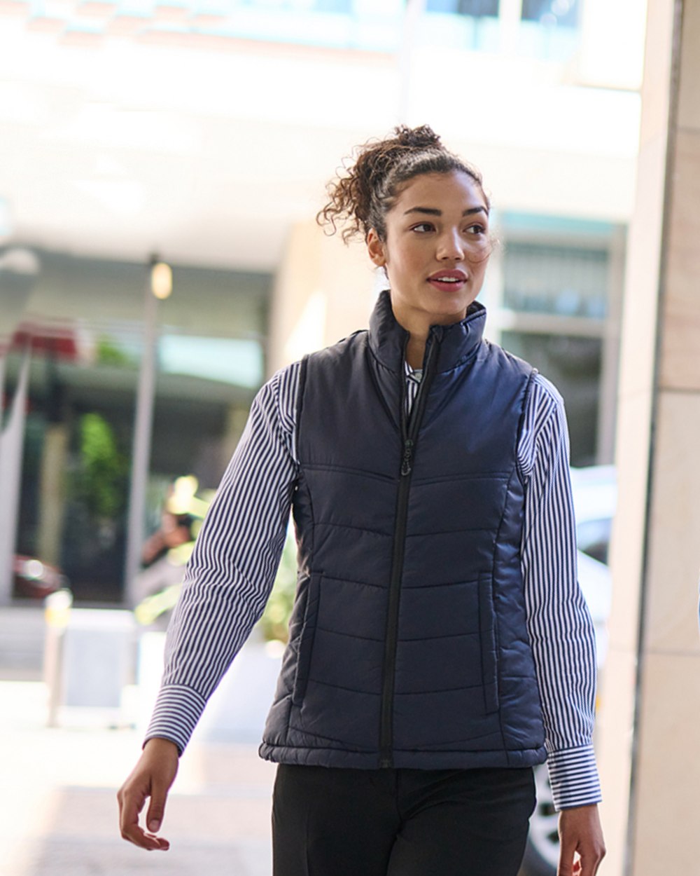 Navy coloured Regatta Womens Stage II Insulated Bodywarmer on blurry background