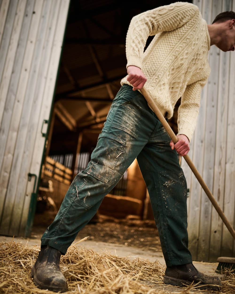 Green coloured Regatta Mens Multi Pocket Action Trousers Long Leg on Stable background