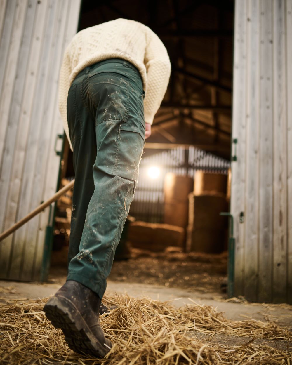 Green coloured Regatta Mens Multi Pocket Action Trousers Long Leg on Stable background