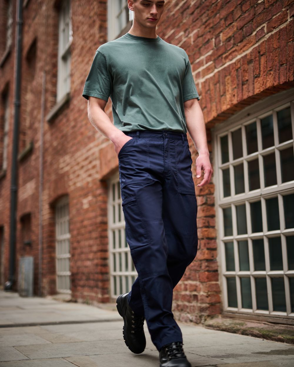 Navy coloured Regatta Mens Multi Pocket Action Trousers Long Leg on street background