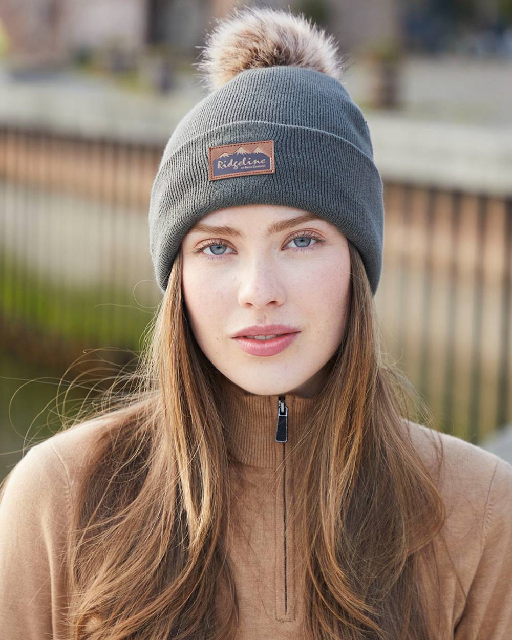 Moss coloured Ridgeline Heritage Fine Knit Bobble Hat on outdoor background